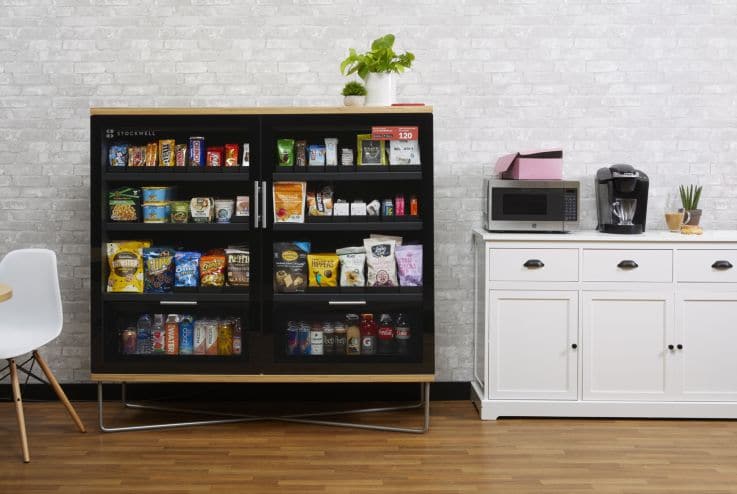 Sleek machine integrated into modern lounge with wood finishes